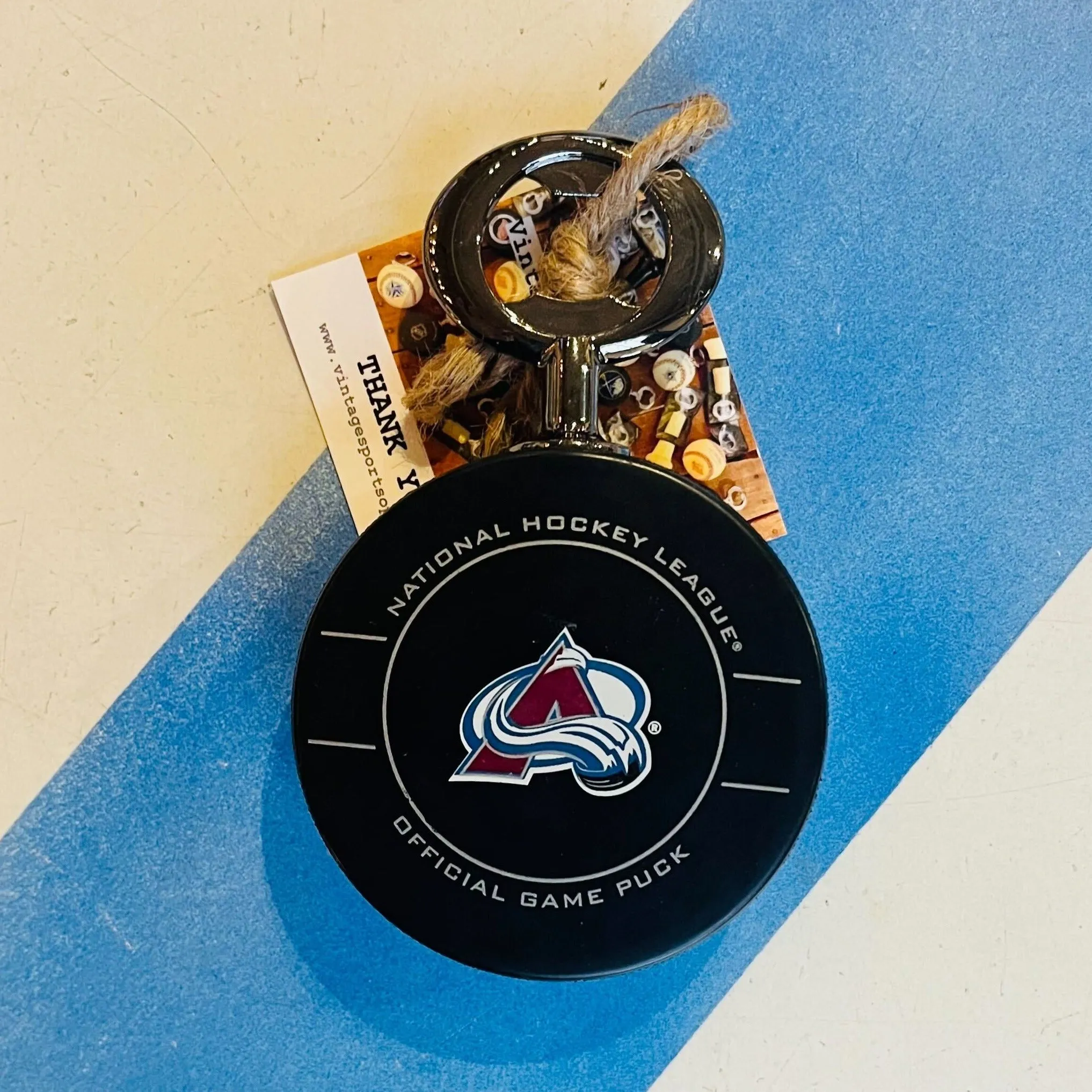 Colorado Avalanche Early 2000s Era Authentic NHL Official Game Hockey Puck Bottle Opener